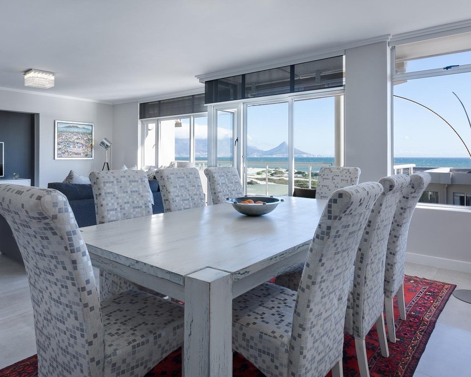 Sea-view living and dining room in a Levimax-managed rental apartment